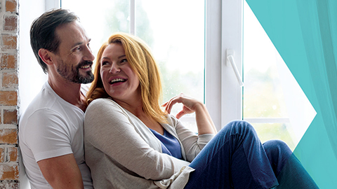 Couple at home with ProteX brochure.